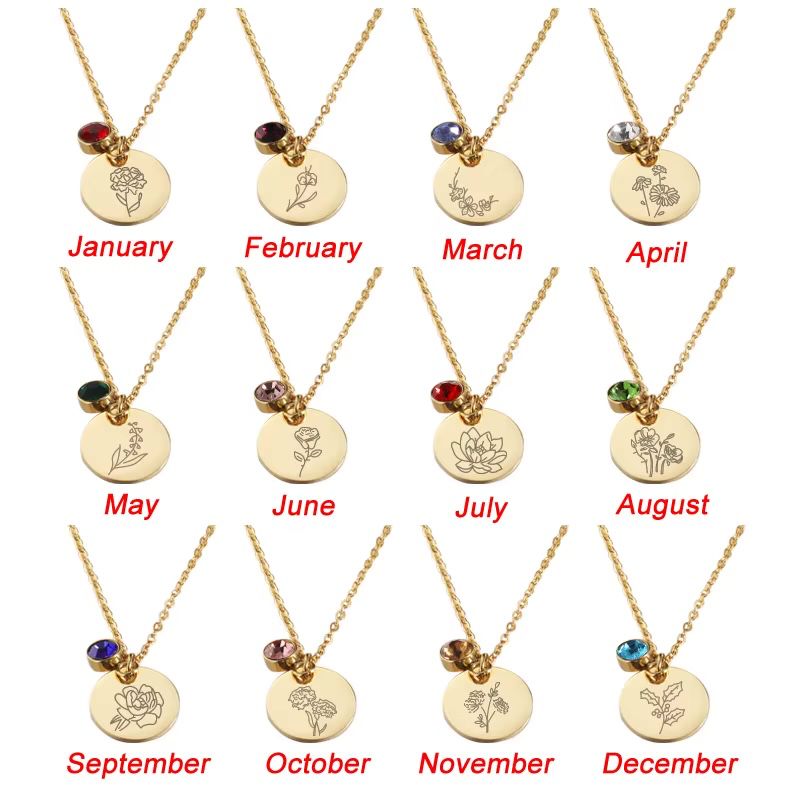 Gold necklaces with circular pendants for each month of the year on a white background.