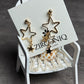 Gold Star Dangle Earrings