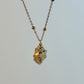 Necklace with a small pendant on a light gray background