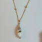 Necklace with a shell pendant on a light background