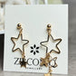 Gold Star Dangle Earrings
