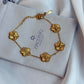Gold floral bracelet on a ZirconiQ jewelry box with a white fabric background