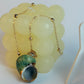 Necklace with a shell pendant on a white background