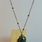 Necklace with a pendant on a light gray background