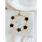 Gold bracelet with black flower-shaped charms on a Zirconiq Jewellery branded card.