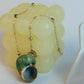 Necklace with a shell pendant on a white background